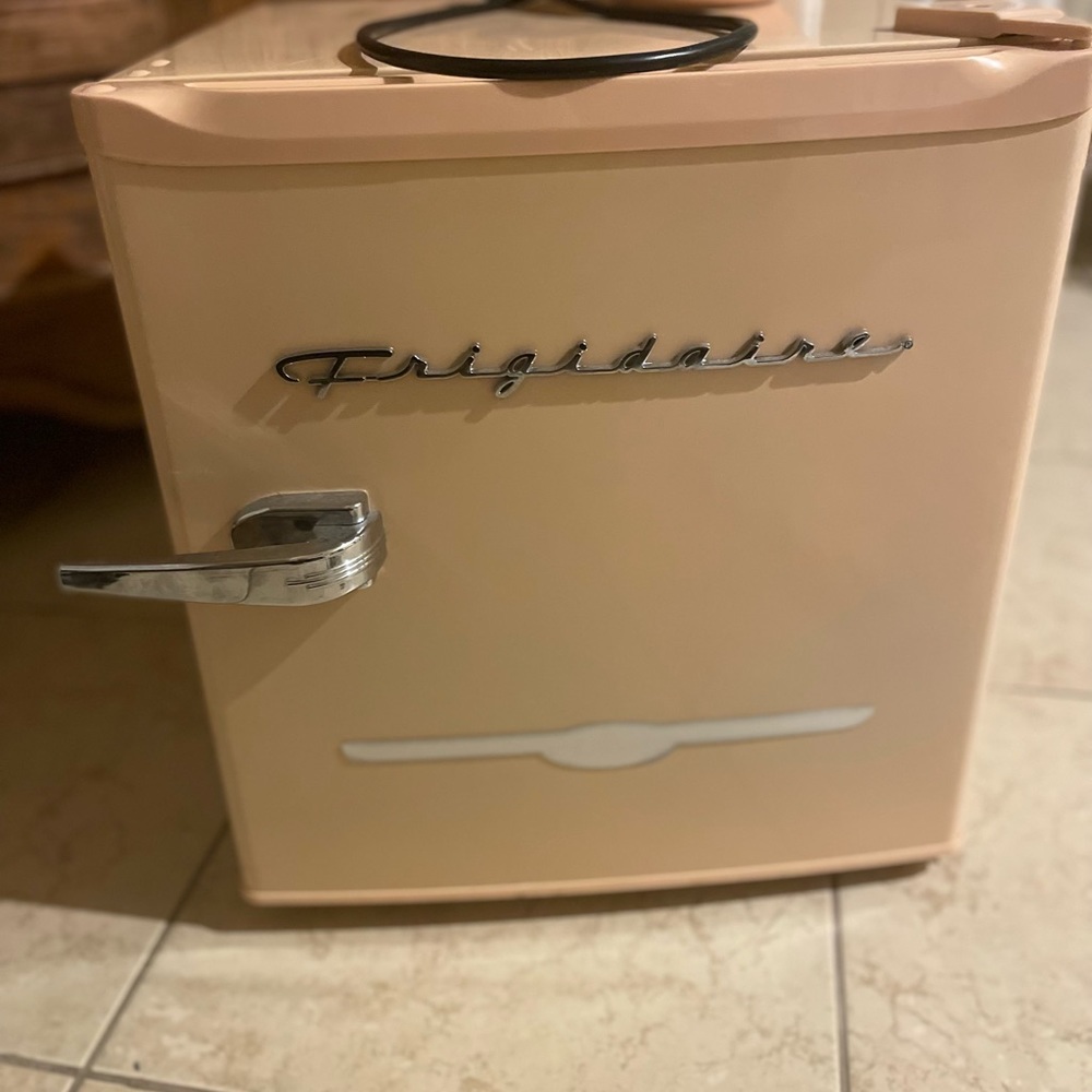 Pink mini fridge